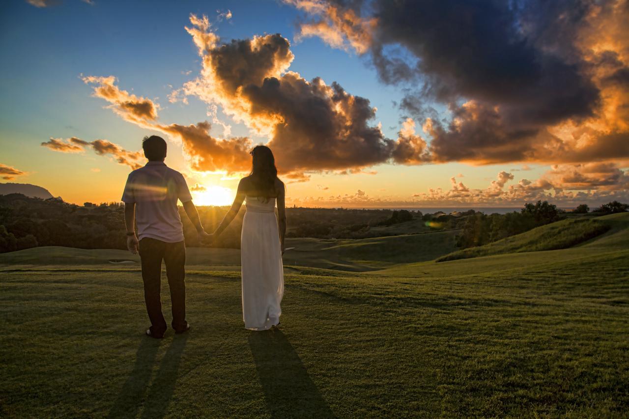 A man and a woman hold hands
